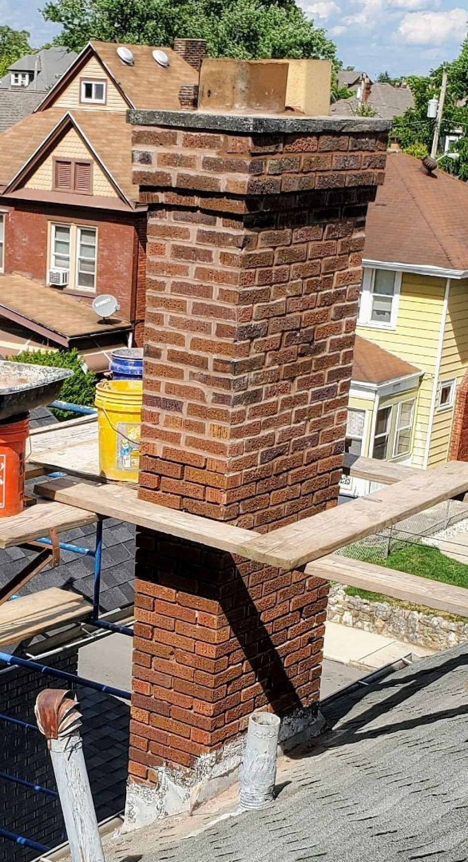 Chimney repairs being completed on this brick chimney.