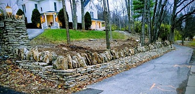 Rebuilt natural stone wall with no mortar. Dry stone walling